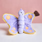 Plush toy butterfly with a pink background